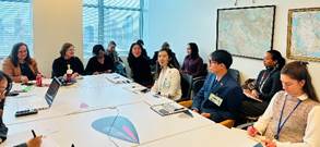 A group of people sitting around a table
AI-generated content may be incorrect.