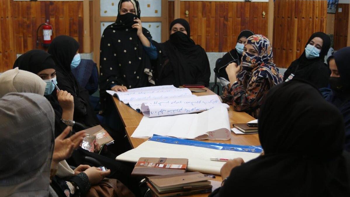 A view of women around the table. 