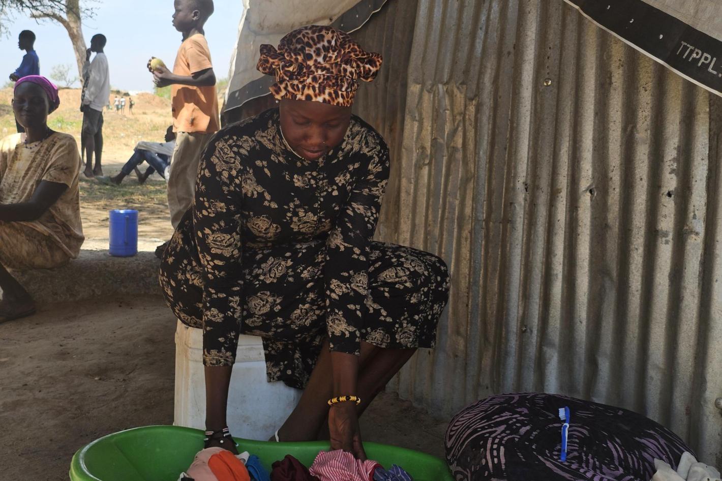 Photograph of young woman in displacement camp